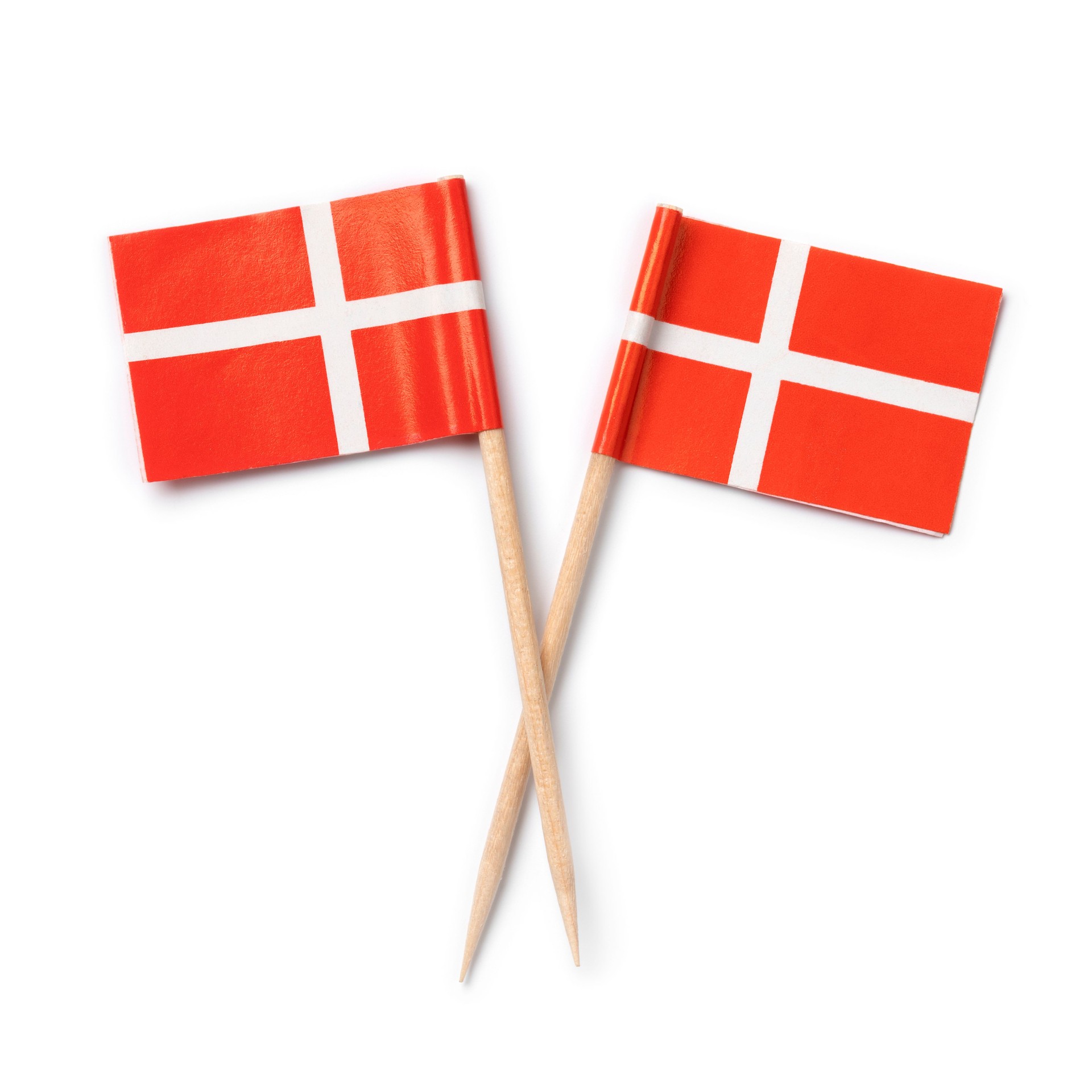 Miniature Danish paper flags close up on white backgroundbackground